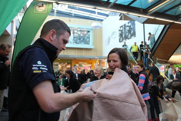 Waikato/Bay of Plenty's Sam Williams is all concentration as he creates a dress out of a wool fadge during the Official Opening.